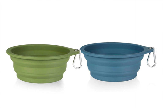 Two collapsible dog bowls in navy blue and dark green made of durable silicone for travel and outdoor use